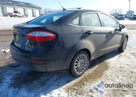 2014 Ford Fiesta Titanium z USA, uszkodzony, nr VIN 3FADP4CJ4EM107071